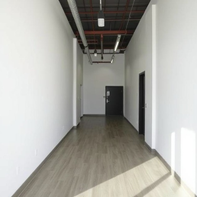 Bena Builders commercial interior with flooring and exposed ceiling